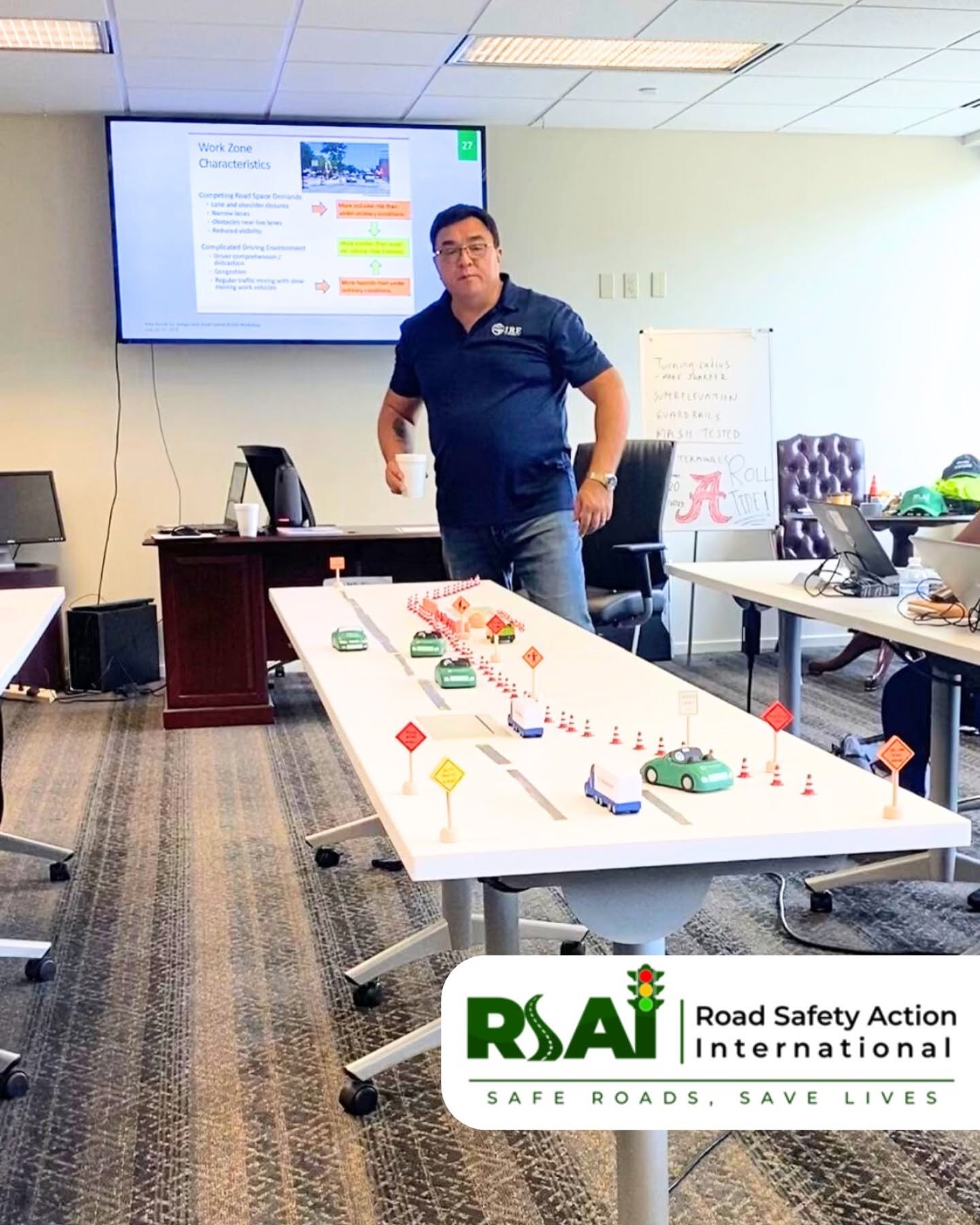 An instructor explains work zone traffic management using a tabletop model.