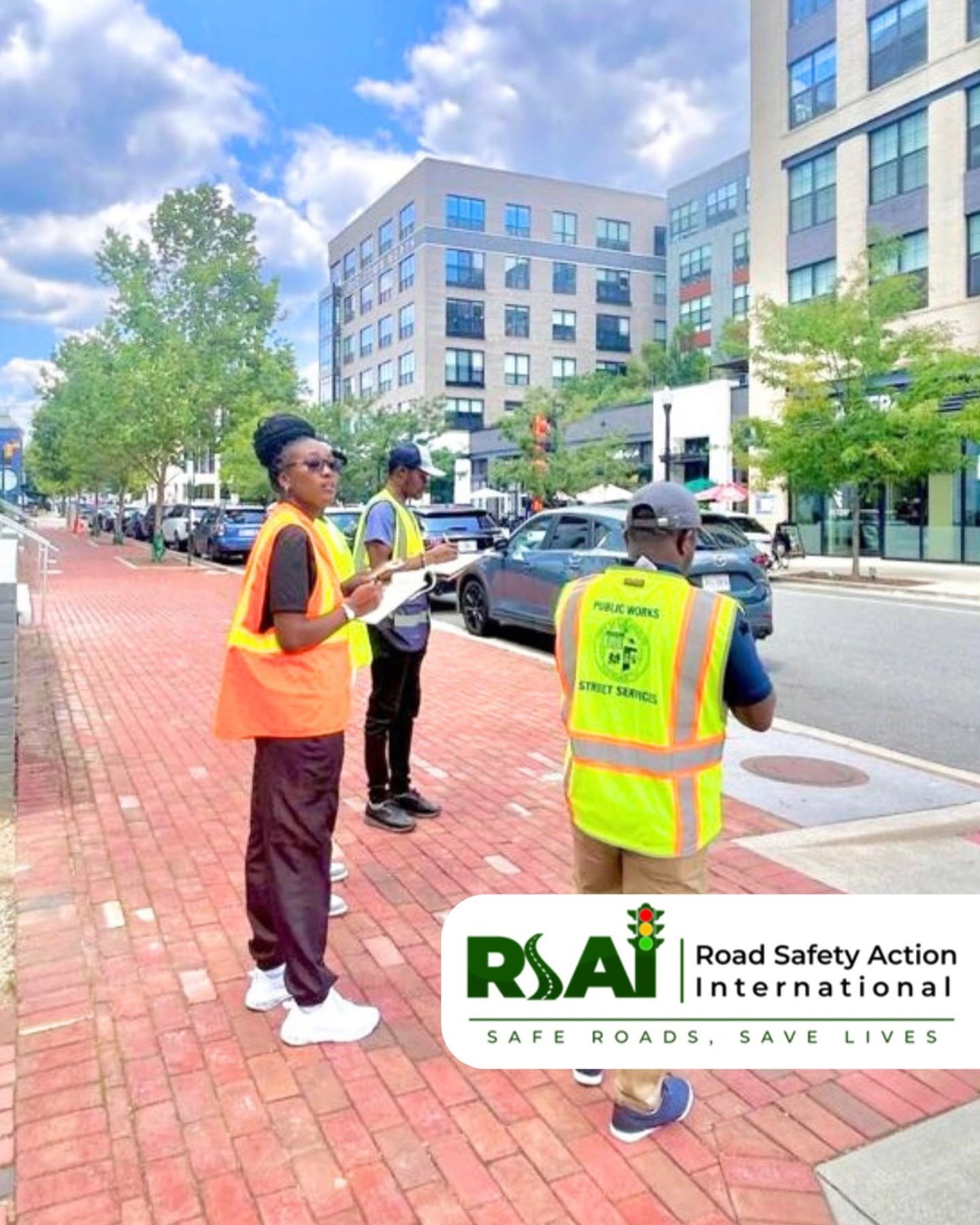 Participants carry out a field exercise on a city street.