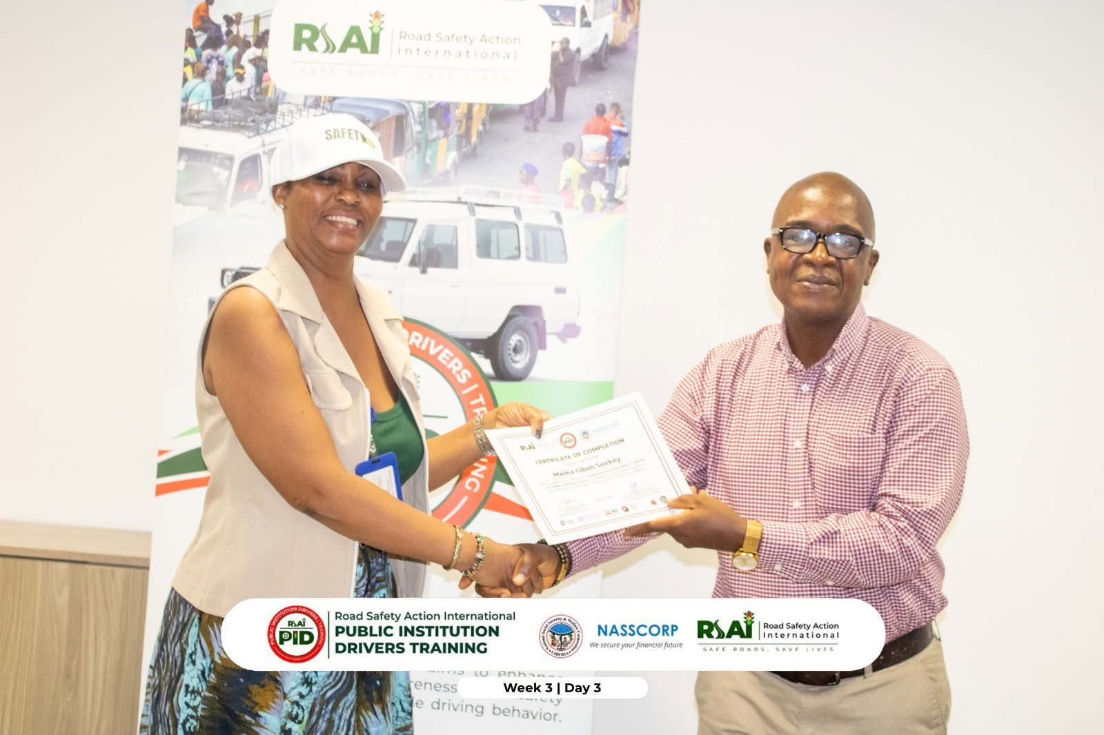 A participant receives her certificate of completion (Week 3, Day 3).