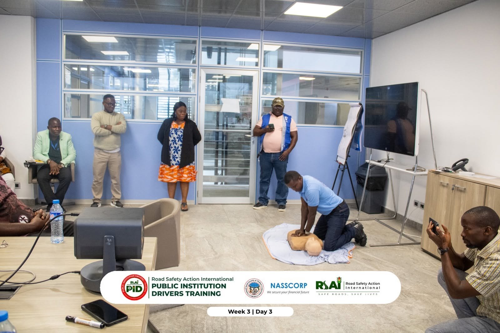 First aid practical: a CPR demonstration on a training mannequin (Week 3, Day 3).